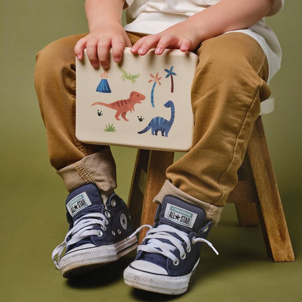 cream lunch bento box with three compartments in dinosaur print