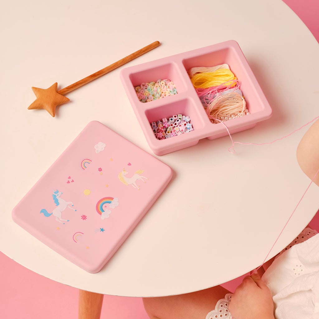 pink lunch bento box with three compartments in unicorn print