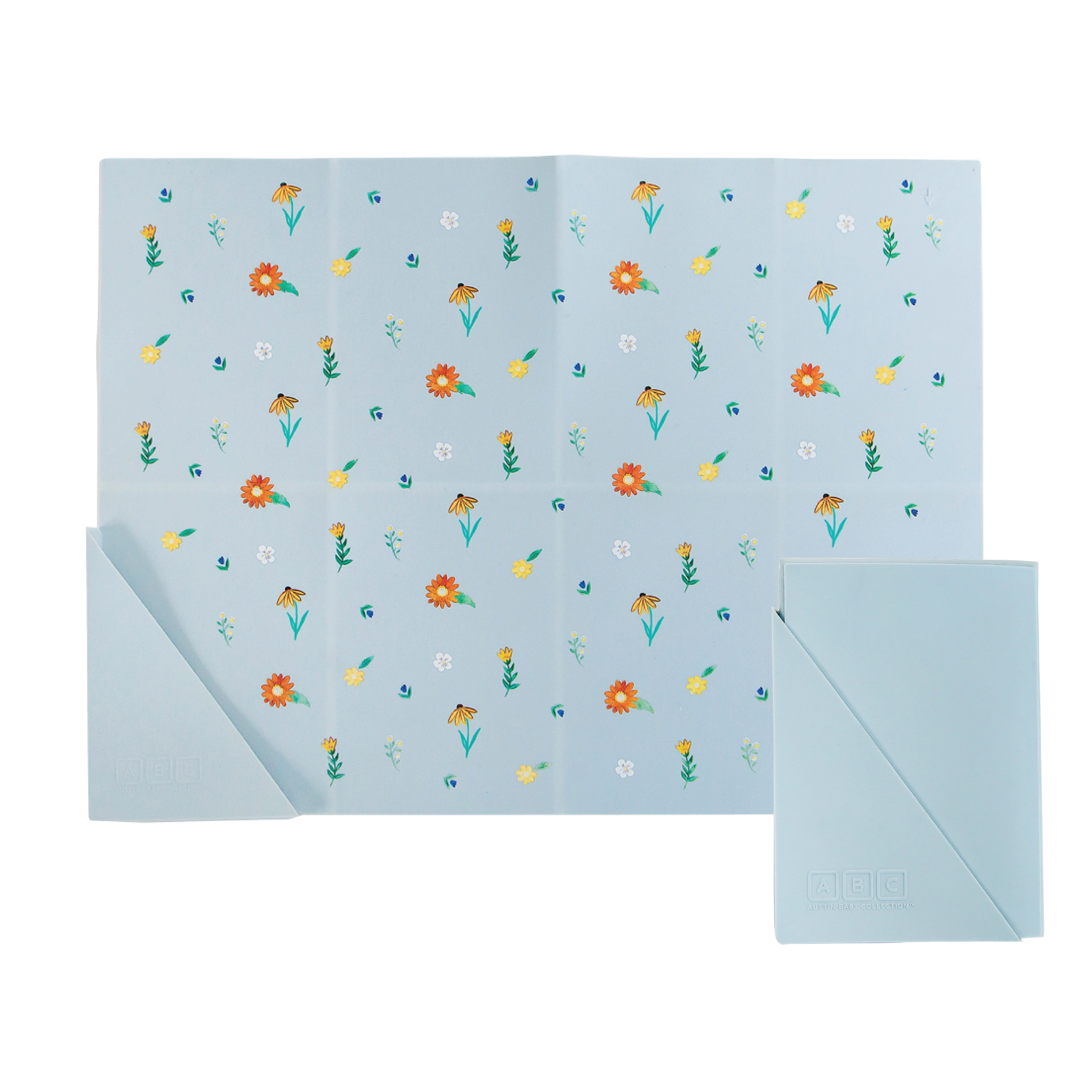 light blue silicone placemat in wildflower print, shown folded and unfolded
