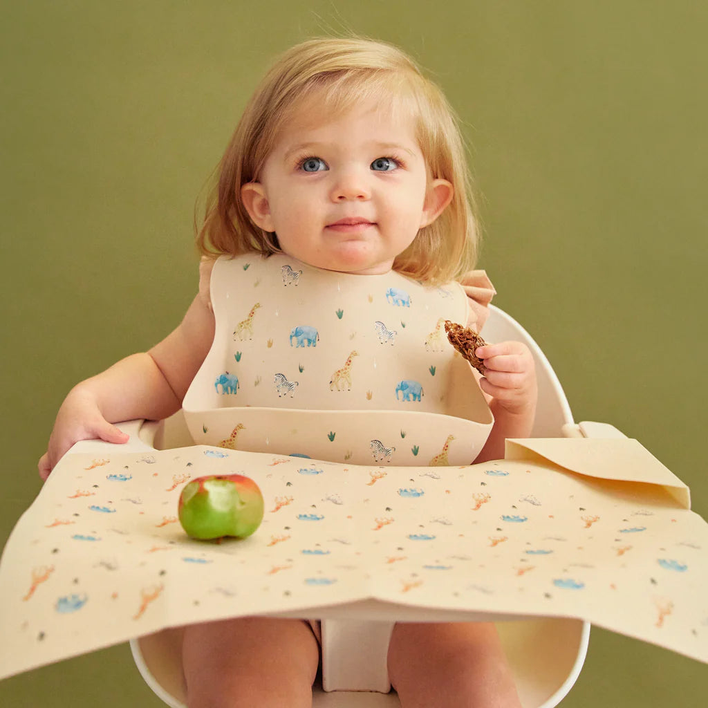 cream feeding bib and placemat in safari animal print