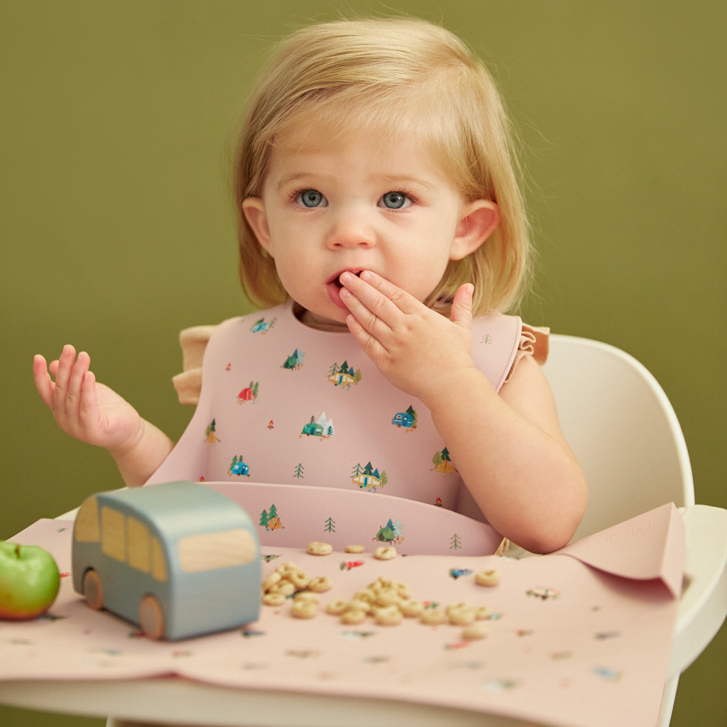 violet silicone feeding bib with front pocket in camping print