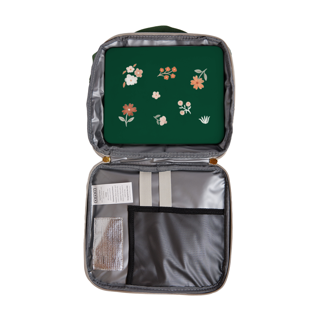 green bento box in white lunch bag