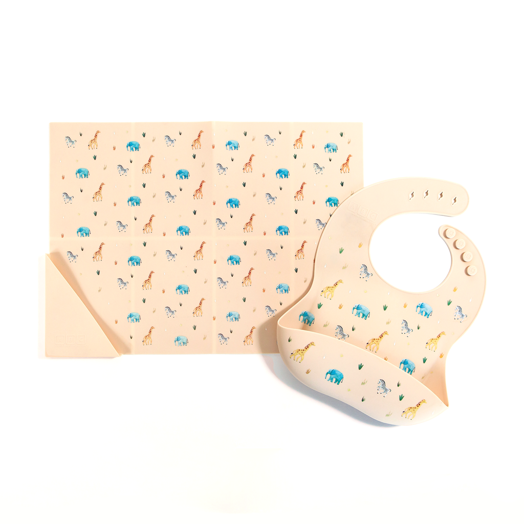 faded black silicone feeding bib with front pocket in safari animal print, with matching silicone placemat