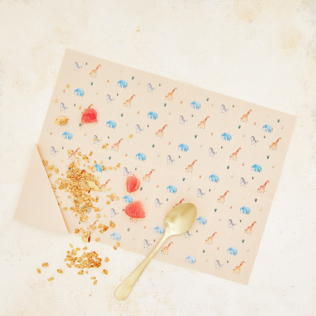 cream silicone placemat in safari animal print