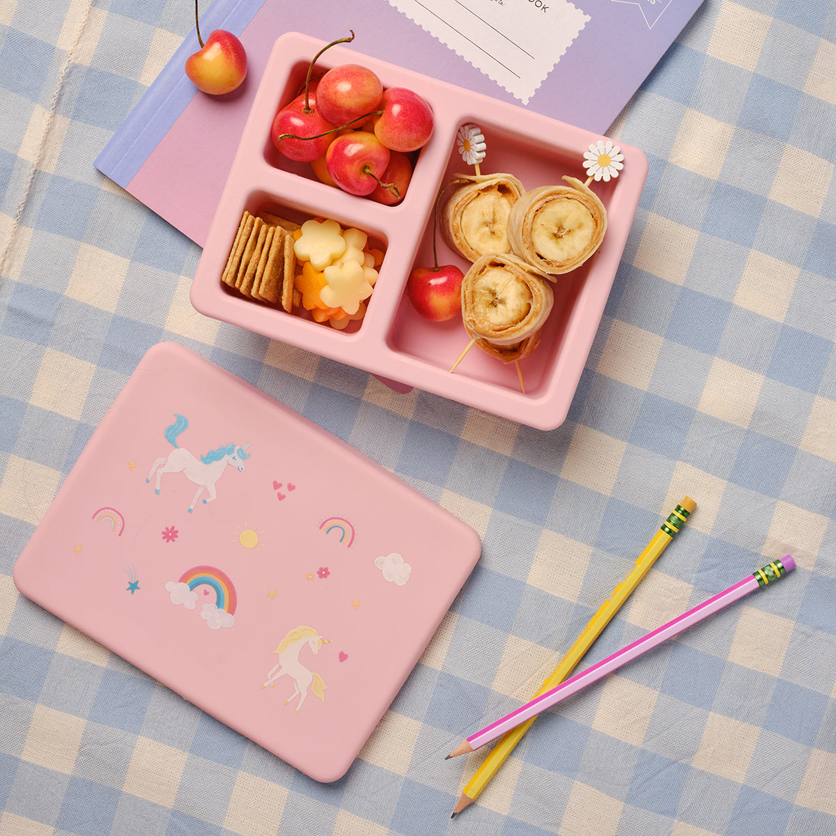 pink lunch bento box with three compartments in unicorn print