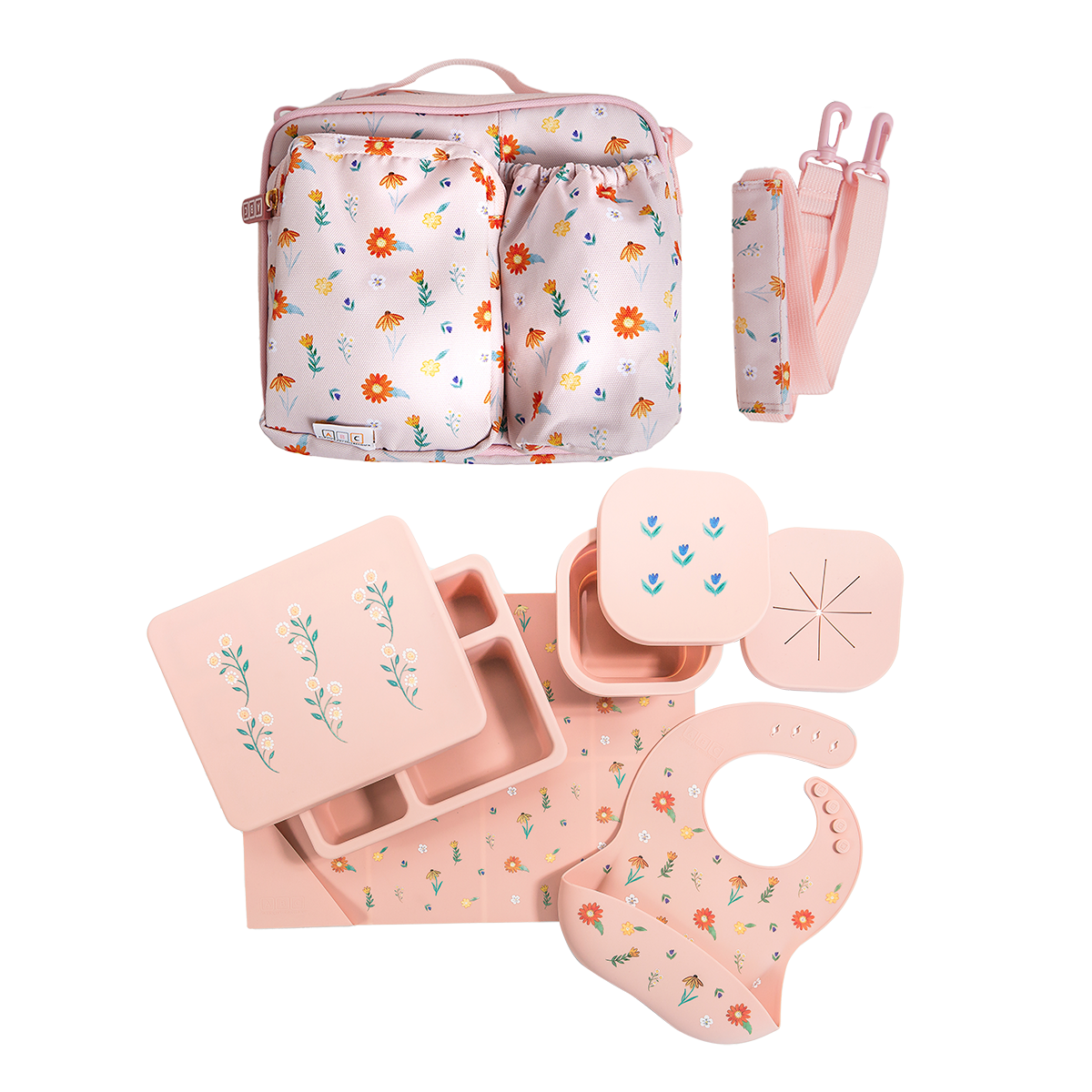 pink lunch bag, silicone lunch bento box, snack bowl, placemat, and bib in wildflower print