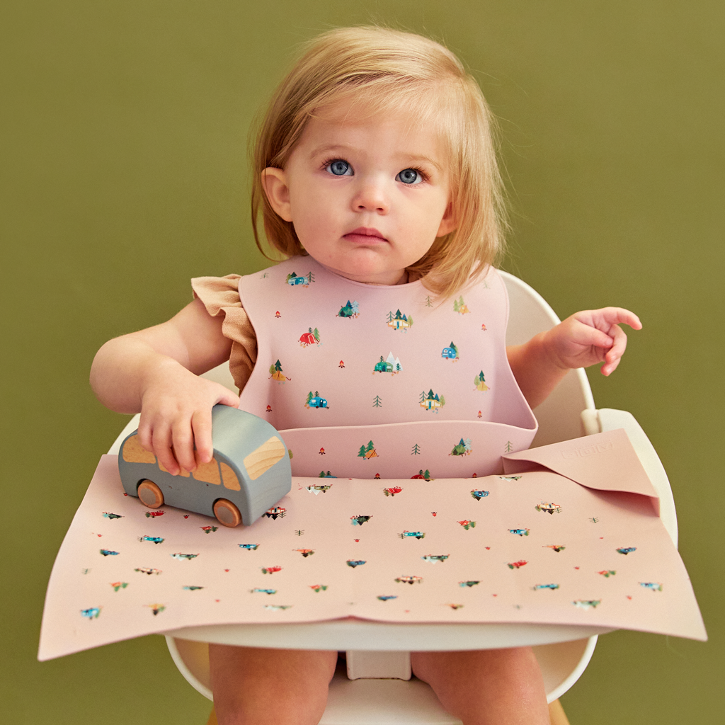 violet silicone feeding bib with front pocket in camping print