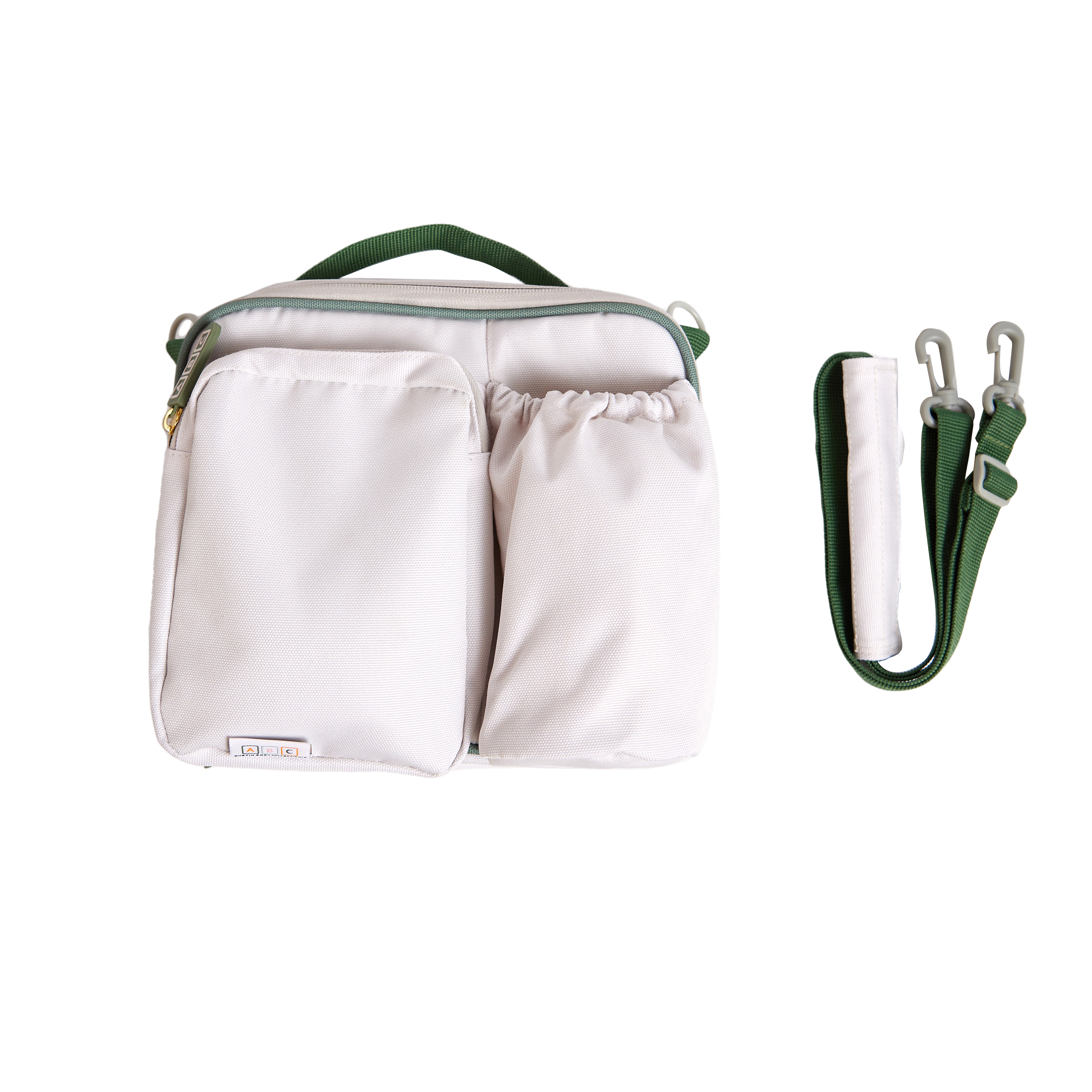 cream lunch bag with green accents and shoulder strap