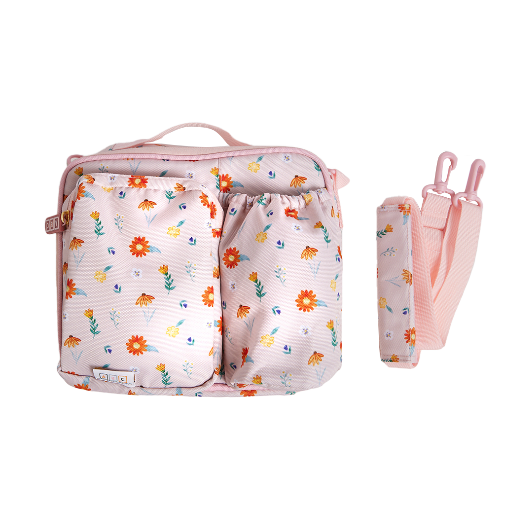 pink lunch bag with wildflower print and shoulder strap